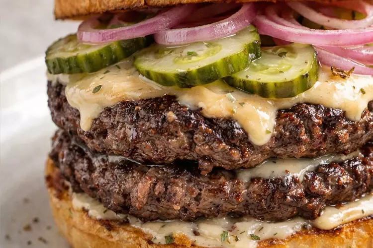 The Butchers Smash: a double-stacked beef burger with pickles, red onion and sauce