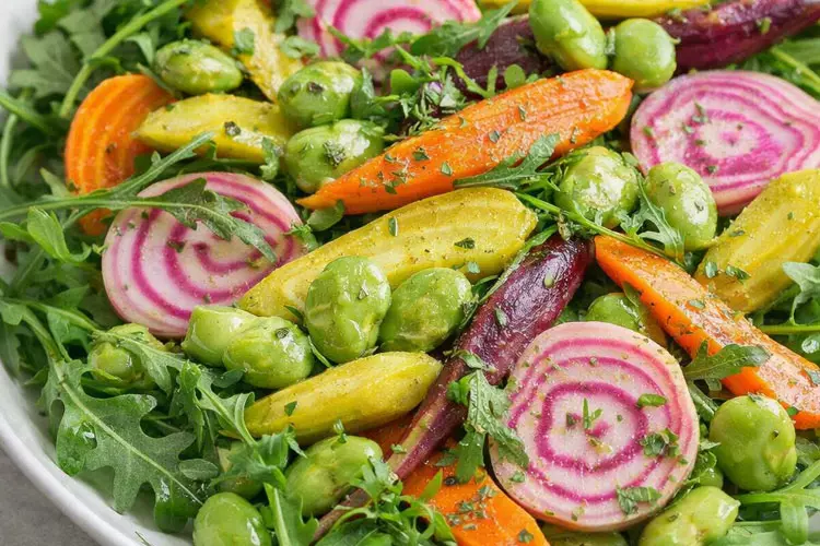 Cooper’s Farm Harvest Salad with arugula, carrots, candy cane beets and fava beans