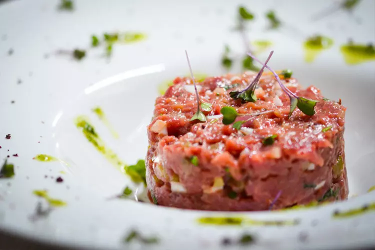 Whittier Farms Steak Tartare topped with microgreens and herb oil